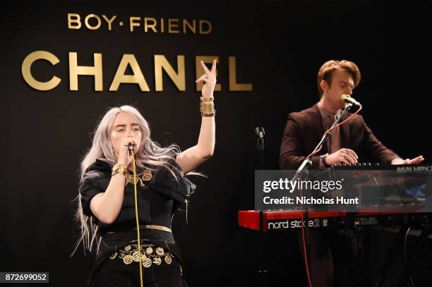 Singer Billie Eilish, wearing CHANEL, and musician Finneas O'Connell perform onstage as CHANEL celebrates the launch of the Coco Club, a Boy-Friend...