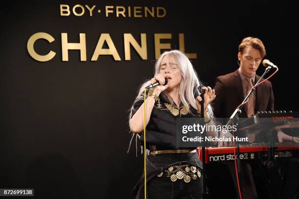 Singer Billie Eilish, wearing CHANEL, and musician Finneas O'Connell perform onstage as CHANEL celebrates the launch of the Coco Club, a Boy-Friend...