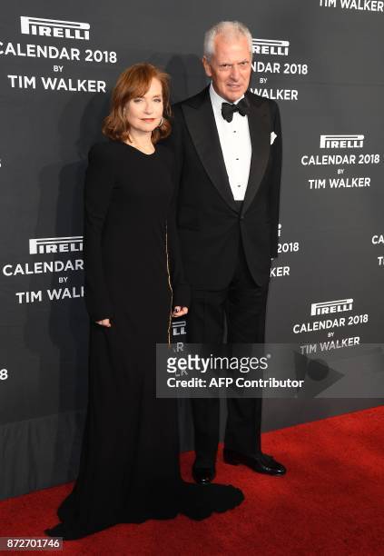 Actress Isabelle Huppert and Chief Executive Officer of Pirelli & C. S.p.A Marco Tronchetti Provera attend the 2018 Pirelli Calendar Launch Gala at...