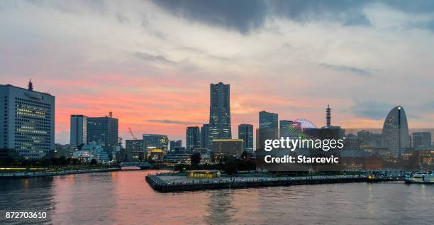 yokohama - minato mirai skyline during beautiful sunset - yokohama skyline stock pictures, royalty-free photos & images