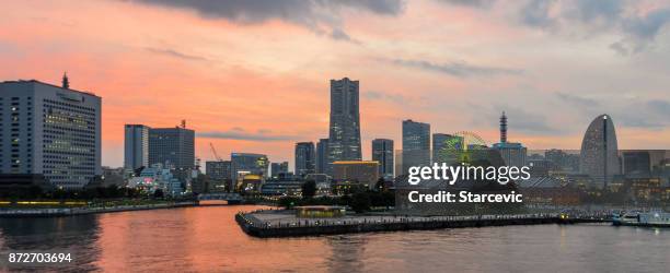 yokohama - minato mirai skyline during beautiful sunset - yokohama skyline stock pictures, royalty-free photos & images