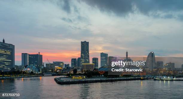 yokohama - minato mirai skyline during beautiful sunset - yokohama skyline stock pictures, royalty-free photos & images