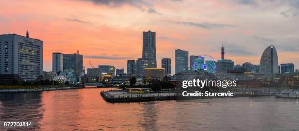 yokohama - minato mirai skyline during beautiful sunset - yokohama skyline stock pictures, royalty-free photos & images