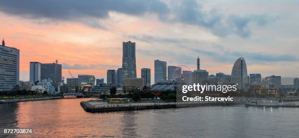 yokohama - minato mirai skyline during beautiful sunset - yokohama skyline stock pictures, royalty-free photos & images