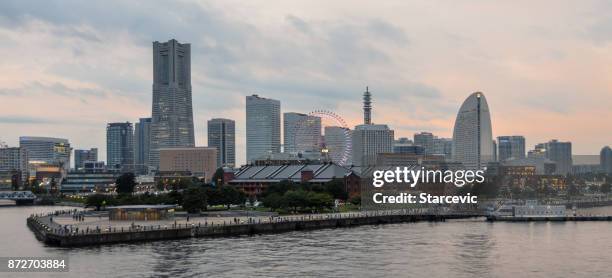 yokohama - minato mirai skyline during beautiful sunset - yokohama skyline stock pictures, royalty-free photos & images