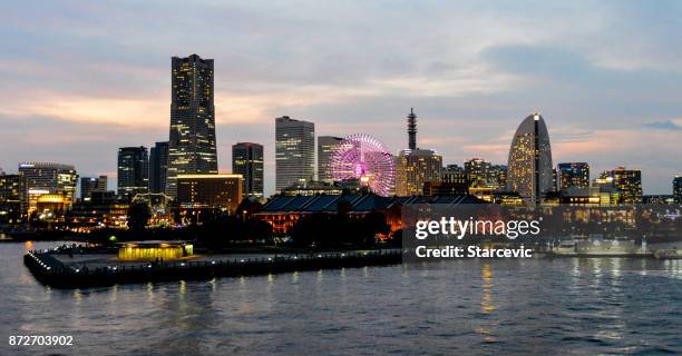 yokohama - minato mirai skyline during beautiful sunset - yokohama skyline stock pictures, royalty-free photos & images