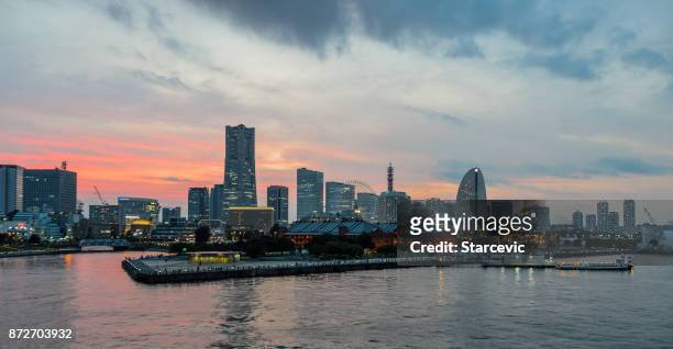 yokohama - minato mirai skyline during beautiful sunset - yokohama skyline stock pictures, royalty-free photos & images