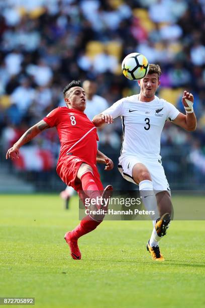 Christian Cueva of Peru competes with Deklan Wynne of the All Whites during the 2018 FIFA World Cup Qualifier match between the New Zealand All...