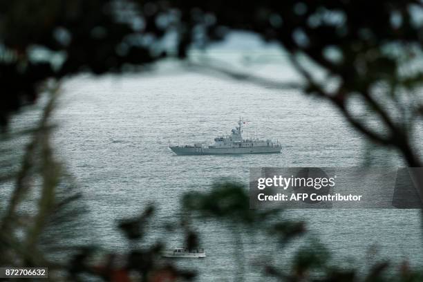 Security vessel is seen on the bay during the APEC Economic Leaders' Meeting, part of the Asia-Pacific Economic Cooperation leaders' summit in the...