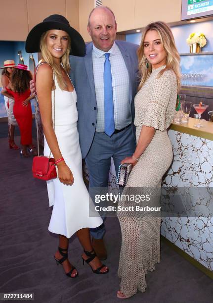 Billy Brownless and daughters Lucy Brownless and Ruby Brownless pose at the Emirates Marquee on Stakes Day at Flemington Racecourse on November 11,...