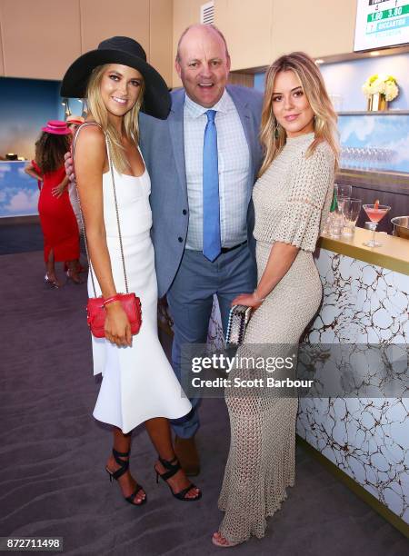 Billy Brownless and daughters Lucy Brownless and Ruby Brownless pose at the Emirates Marquee on Stakes Day at Flemington Racecourse on November 11,...