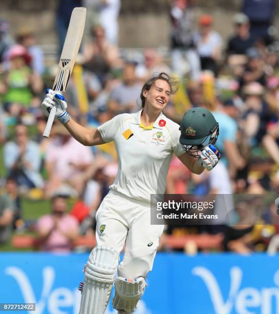 Ellyse Perry of Australia celebrates her century during day three of the Women's Test match between Australia and England at North Sydney Oval on...