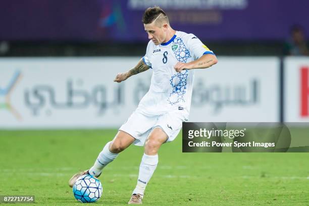 Server Djeparov of Uzbekistan in action during their 2018 FIFA World Cup Russia Final Qualification Round Group A match between China PR and...