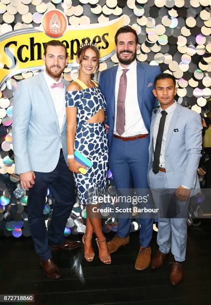 Henry Nicholson, Sarah Tilleke, Locky Gilbert and Jericho Malabonga pose at the Schweppes Marquee on Stakes Day at Flemington Racecourse on November...