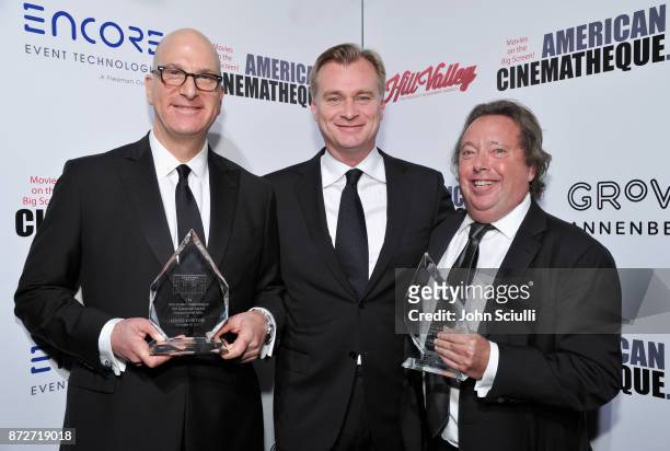 Christopher Nolan with honorees Greg Foster of IMAX and Richard Gelfond of IMAX , recipients of the Sid Grauman Award, attend the 31st American...
