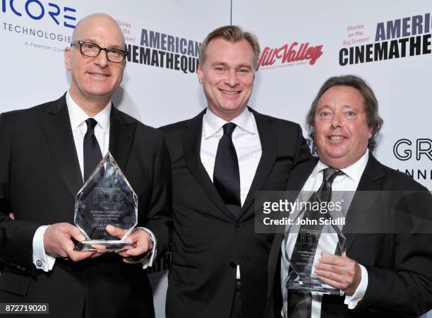 Christopher Nolan with honorees Greg Foster of IMAX and Richard Gelfond of IMAX , recipients of the Sid Grauman Award, attend the 31st American...