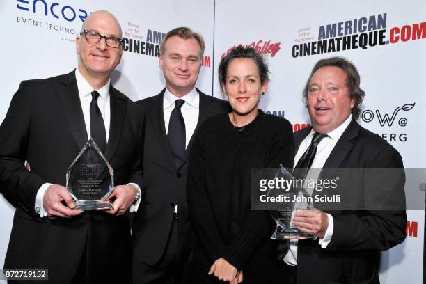 Christopher Nolan and Emma Thomas with honorees Greg Foster of IMAX and Richard Gelfond of IMAX , recipients of the Sid Grauman Award, attend the...