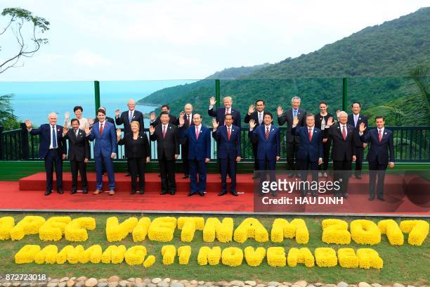 Leaders pose for the "family photo" during the Asia-Pacific Economic Cooperation leaders' summit in the central Vietnamese city of Danang on November...