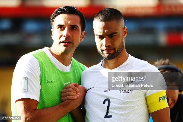 Rory Fallon and Winston Reid of the All Whites walk off after drawing the 2018 FIFA World Cup Qualifier match between the New Zealand All Whites and...