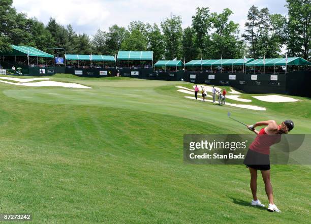 Actress Paula Trickey hits to the 18th green during the second round of the BMW Charity Pro-Am at Thornblade Club held on May 15, 2009 in Greer,...