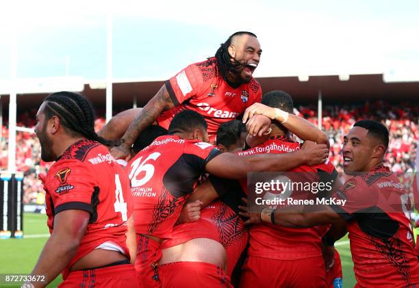 Mahe Fonua and his Tonga team mates celebrate during the 2017 Rugby League World Cup match between the New Zealand Kiwis and Tonga at Waikato Stadium...