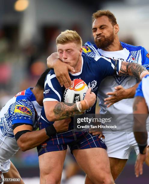 Danny Addy of Scotland is tackled during the 2017 Rugby League World Cup match between Samoa and Scotland at Barlow Park on November 11, 2017 in...