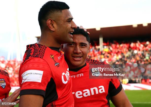 Jason Taumalolo and Daniel Tupou celebrate during the 2017 Rugby League World Cup match between the New Zealand Kiwis and Tonga at Waikato Stadium on...