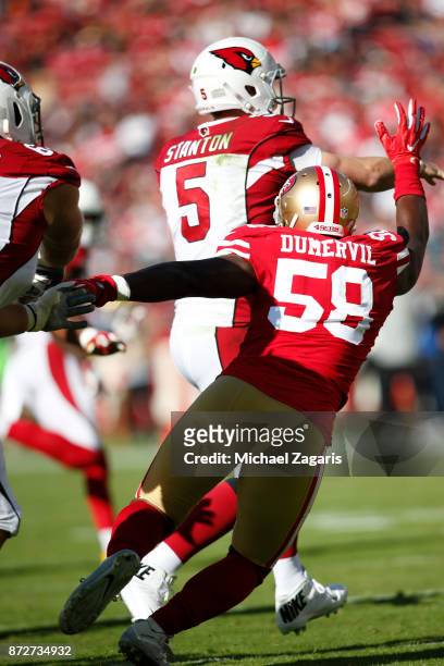 Elvis Dumervil of the San Francisco 49ers pressures Drew Stanton of the Arizona Cardinals during the game at Levi's Stadium on November 5, 2017 in...