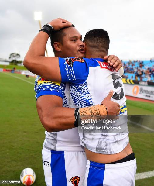 Matthew Wright of Samoa celebrates after scoring a try with Joseph Leilua during the 2017 Rugby League World Cup match between Samoa and Scotland at...