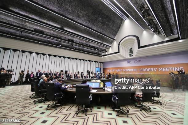 Leaders attend the APEC Economic Leaders' Meeting, part of the Asia-Pacific Economic Cooperation leaders' summit in the central Vietnamese city of...