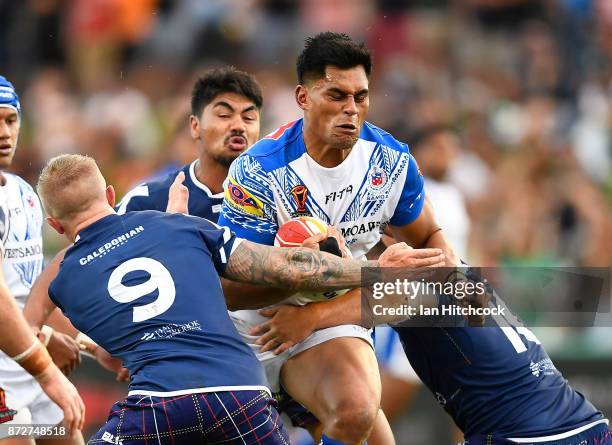 Herman Ese'ese of Samoa is tackled by by Callum Phillips of Scotland during the 2017 Rugby League World Cup match between Samoa and Scotland at...