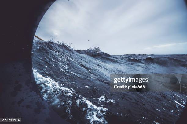 fishingboat vessel fishing in a rough sea - storm outside window stock pictures, royalty-free photos & images