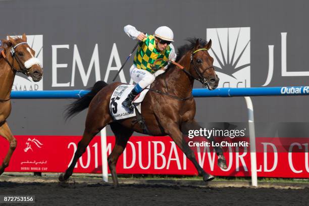 Jockey Olivier Peslier riding Rabbah De Carrere wins the Dubai Kahayla Classic during the Dubai World Cup race day at the Meydan racecourse on March...