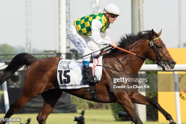 Jockey Olivier Peslier riding Rabbah De Carrere wins the Dubai Kahayla Classic during the Dubai World Cup race day at the Meydan racecourse on March...