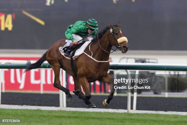 Jockey Jamie Spencer riding Certerach wins the Dubai Gold Cup during the Dubai World Cup race day at the Meydan racecourse on March 29, 2014 in...