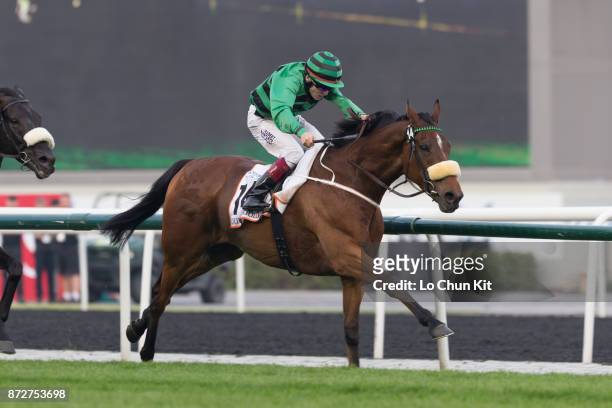 Jockey Jamie Spencer riding Certerach wins the Dubai Gold Cup during the Dubai World Cup race day at the Meydan racecourse on March 29, 2014 in...