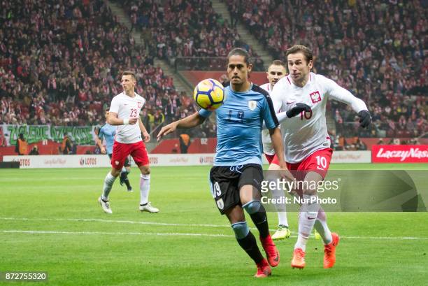 Mauricio Lemos and Grzegorz Krychowiak during the international friendly soccer match between Poland and Uruguay at the PGE National Stadium in...