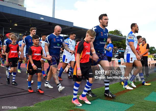 Scotland and Samoan players walk out onto the field for the start of the 2017 Rugby League World Cup match between Samoa and Scotland at Barlow Park...