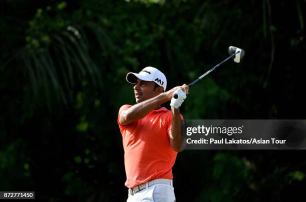 Jyoti Randhawa of India plays a shot during round three of the Resorts World Manila Masters at Manila Southwoods Golf and Country Club on November...