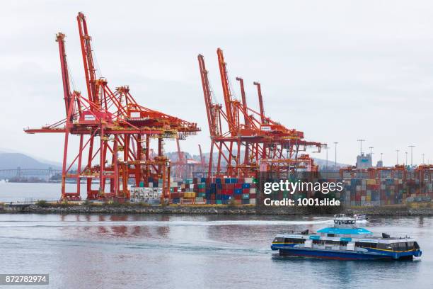 ferryboat with cranes at vancouver harbor - ferry stock pictures, royalty-free photos & images