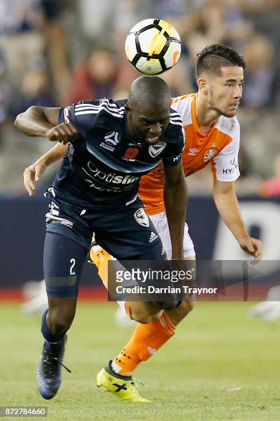 Connor O'Toole of the Roar takes down Jason Geria of the Victory during the round six A-League match between the Melbourne Victory and Brisbane Roar...