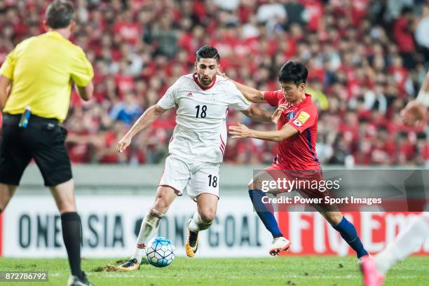 Alireza Jahan Bakhsh of Iran fights for the ball with Kim Jinsu of Korea Republic during their 2018 FIFA World Cup Russia Final Qualification Round...