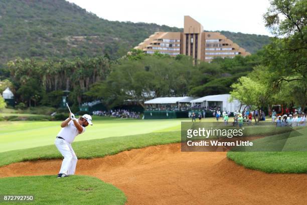 Victor Dubuisson of France hits his second shot on the 9th hole during the third round of the Nedbank Golf Challenge at Gary Player CC on November...