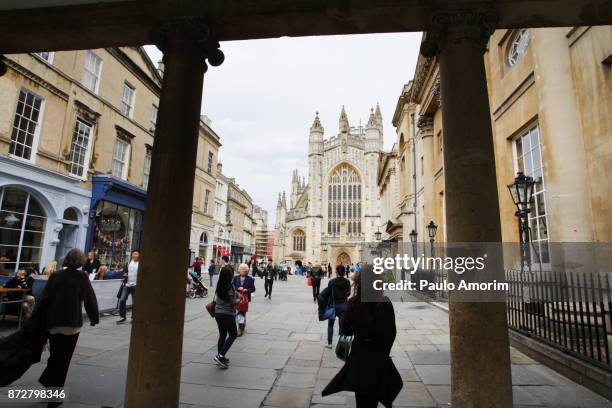 people enjoying on the street in bath,england - roman bath england stock pictures, royalty-free photos & images