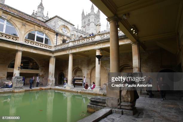 people enjoying the view at the roman baths in england - roman bath england stock pictures, royalty-free photos & images