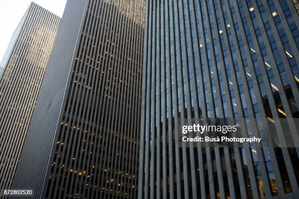 office towers along 6th avenue in midtown manhattan, new york city - avenue of the americas stock pictures, royalty-free photos & images