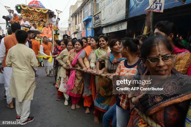 Indian Hindu devotees pull a chariot of the deity Lord Jagannath, his brother Balabhadra and sister Subhadra during the annual Jagannath Rath Yatra...