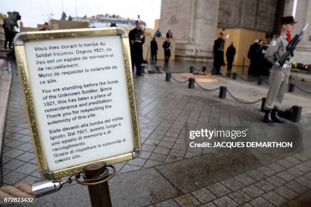 Picture taken on November 11, 2017 shows a panel at the entrance of the Tomb of the Unknown soldier beneath the Arc de Triomphe, in Paris, during the...