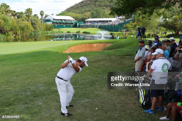 Victor Dubuisson of France hits his second shot on the 18th hole during the third round of the Nedbank Golf Challenge at Gary Player CC on November...
