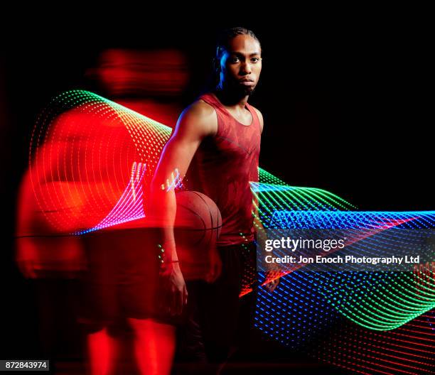 man moves with basket ball - jon enoch stock pictures, royalty-free photos & images